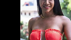 sindy models her orange swimsuit