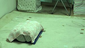 A fair-skinned asian girl in lingerie and stockings feels aroused while masturbating her big tits and boobs