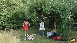 Mature brunette feels huge tits on cock in forest