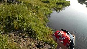 Beautiful brunette girl in short dress at wild beach