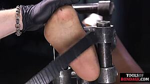 ebony bdsm slave bound for foot domination in stockings