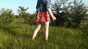 Beautiful brunette girl in short dress at wild beach