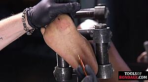 ebony bdsm slave bound for foot domination in stockings