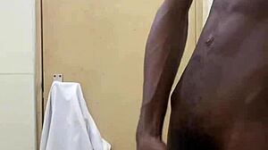 busting a huge cumshot in public toilet with big black cock