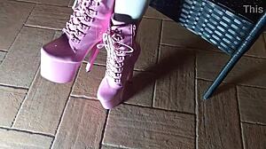 Sitting seductively on chair in tight pantyhose and high heeled boots