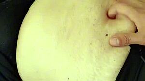 Amateur milf explores orgasmic belly fetish.