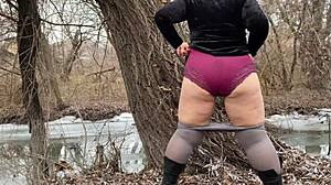 mother-in-law in white pantyhoses and big panties pees outdoors