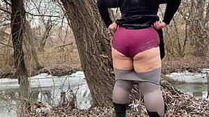 mother-in-law in white pantyhoses and big panties pees outdoors