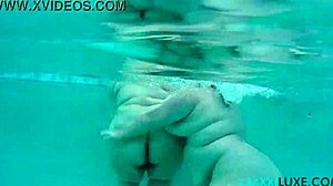 Busty BBW Lexxxi Luxe splashes with friend underwater