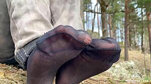 beautiful nylon feet in jeans teased outdoors close up