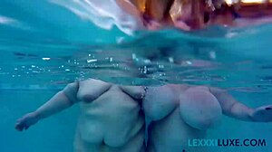 Busty BBW Lexxxi Luxe splashes with friend underwater