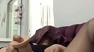 mature woman subtly enjoys intimate self-pleasure in private moments.