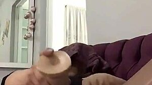 mature woman subtly enjoys intimate self-pleasure in private moments.