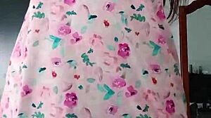 Model poses in sexy pink pajamas with innocent colleague