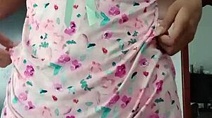 Model poses in sexy pink pajamas with innocent colleague