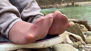 beautiful nylon feet in jeans teased outdoors close up