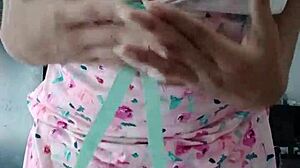 Model poses in sexy pink pajamas with innocent colleague