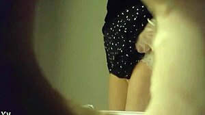 hidden cam captures sexy babe in white panties peeing in toilet through wall hole.