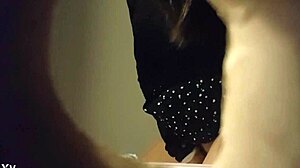 hidden cam captures sexy babe in white panties peeing in toilet through wall hole.