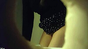 hidden cam captures sexy babe in white panties peeing in toilet through wall hole.
