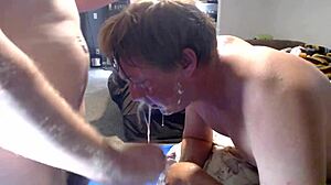 Master throatfucks slave and pours puke in mouth