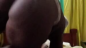 african milf with big black ass masturbates alone in bedroom, hinting at gaping fun