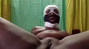 african milf with big black ass masturbates alone in bedroom, hinting at gaping fun