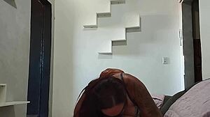 submissive slut squirts on rubber dick while sucking lover's cock on living room couch