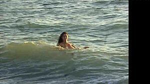 Naked latina girl bent over on public beach