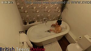 British teen relaxes in the bath.