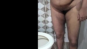 Indian step mom feels embarrassed pissing nude in bathroom