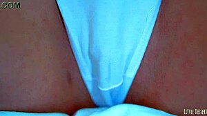 Sexy latin girl shows off her big round ass in a white thong under a blue dress