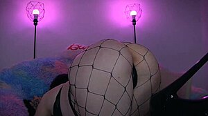 goth girl in fishnets and tattoos