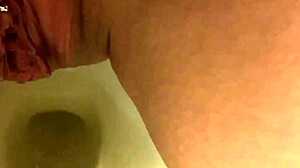 my pretty pierced pussy peeing in bathroom
