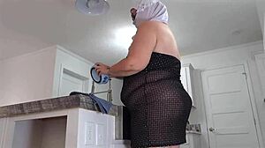 Busty MILF maid flashes pussy close up