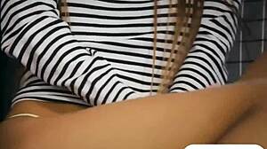 sexy babe moans as she finger fucks her shaved pussy