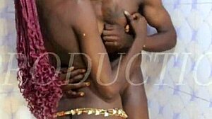 African couple kisses and sucks in shower