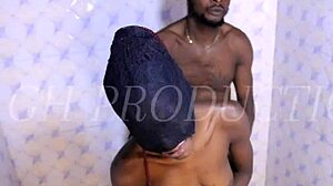 African couple kisses and sucks in shower