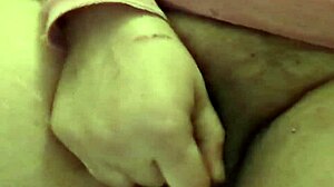 Latina amateur inserts tiny bottle into pussy in bathroom close up