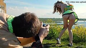 Spunky teen model undresses in miniskirt, exposing tits and pussy during outdoor erotic photoshoot