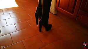 Intriguing Tall Mistress in Boots Dominates Slave in Garage