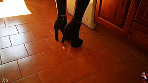 Intriguing Tall Mistress in Boots Dominates Slave in Garage
