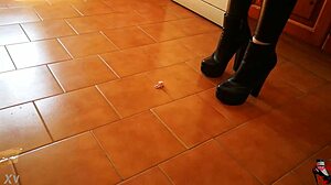 Intriguing Tall Mistress in Boots Dominates Slave in Garage