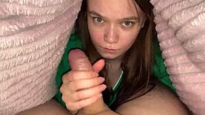 Stepdaughter sneaks under blanket for deep blowjob with stepfather in bedroom. It's her first time exploring taboo roleplay as girl next door.