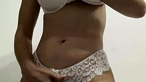 Hot wife in white lingerie with big tits fucks her pussy with a big dildo