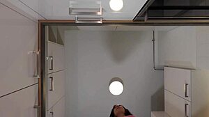 Hey check out this hot redhead tattooed cheerleader in over knee socks revealing her see through panties in the kitchen