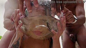 The beautiful hot Brazilian Elisa Santos takes on four big studs for intense double anal penetration with piss drinking.