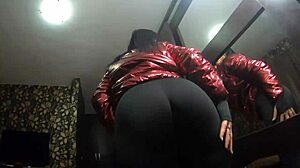 the nympho wife teases in her camel-toe jumpsuit. she adds cum to her shiny red down-jacket.
