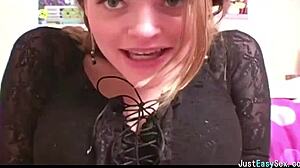 pigtailed brunette teases solo by squeezing and rubbing her big tits in playful amateur display