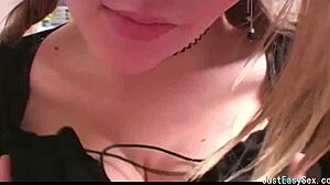 pigtailed brunette teases solo by squeezing and rubbing her big tits in playful amateur display